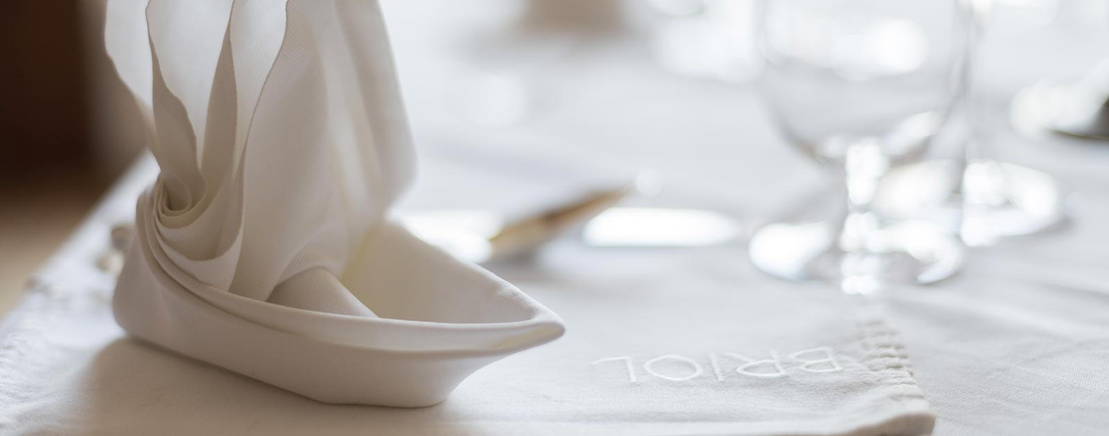 a folded serviette on a table at Hotel Briol in Barbiano