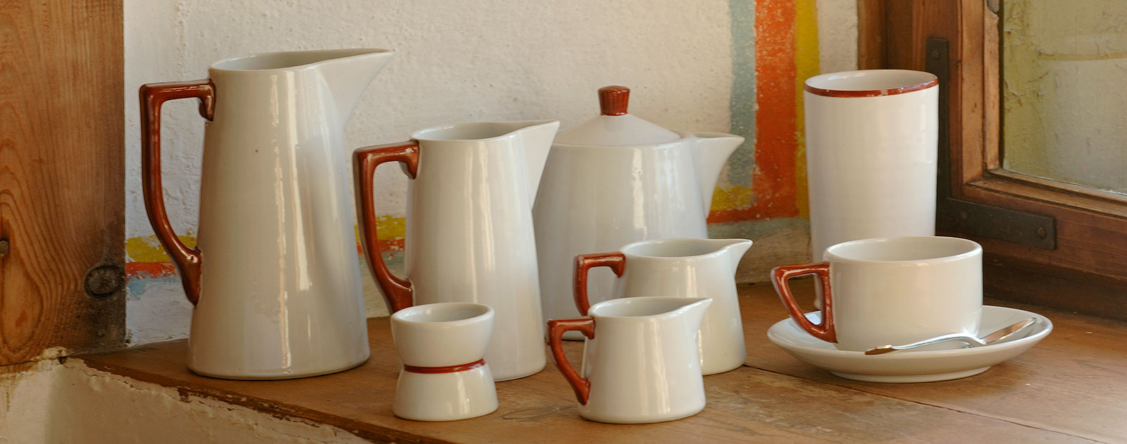 Set of antique teapots and milk jars with one cup